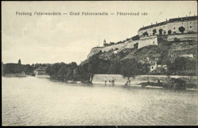 Petrovaradin fortress from across the Danube, with bathers at the wall, 1896–1918