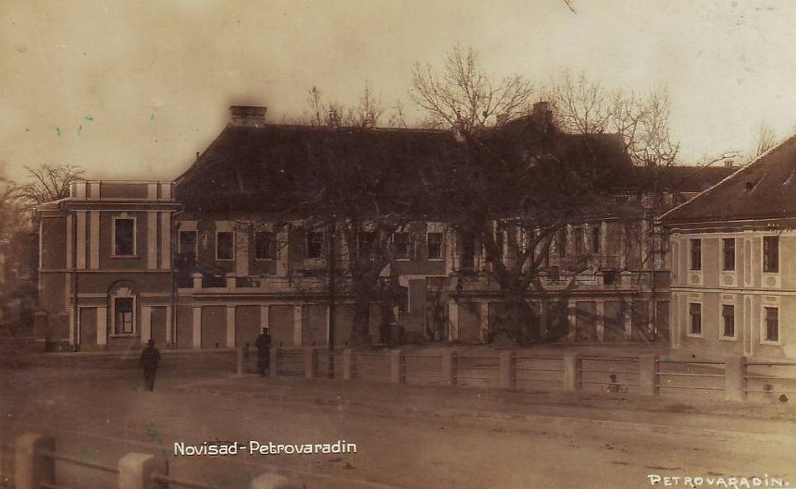 Bare trees before a long building, Petrovaradin, Novi Sad, 1941