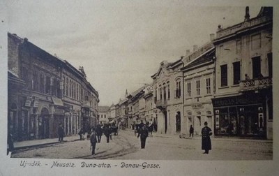 A man in a long coat walking away, Dunavska, Novi Sad, 1900s