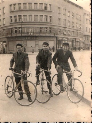 Three cyclists outside the pharmacy, Queen Mary Boulevard, Novi Sad, around 1950