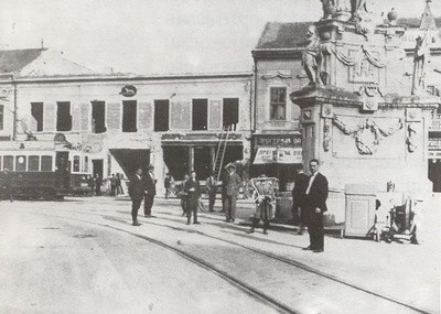Men standing at the column base, Liberty Square, Novi Sad, 1911–1947